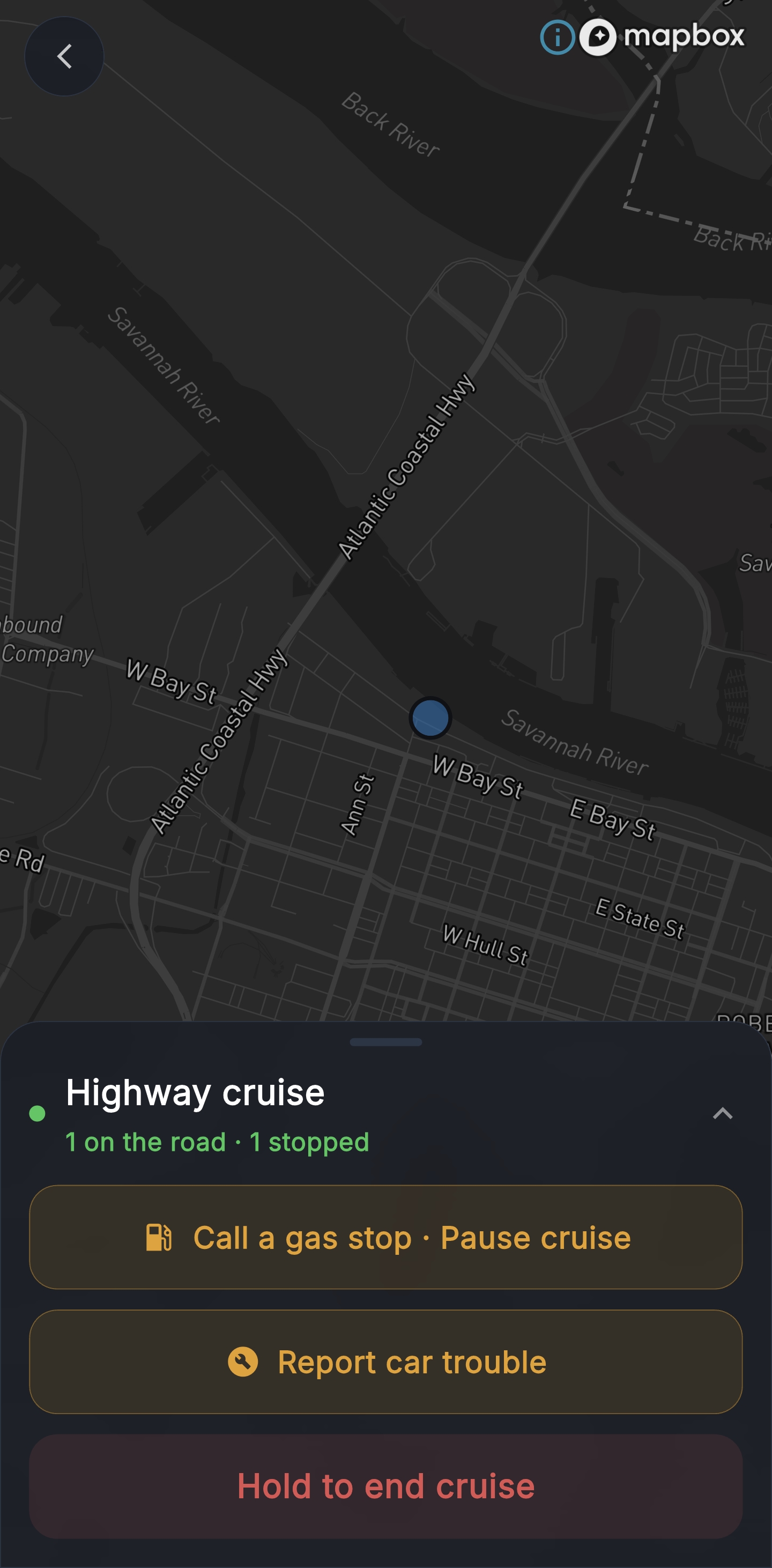 Cruising Mode live convoy map — dark Mapbox with crew positions, gas-stop pause and report-car-trouble controls, hold-to-end button